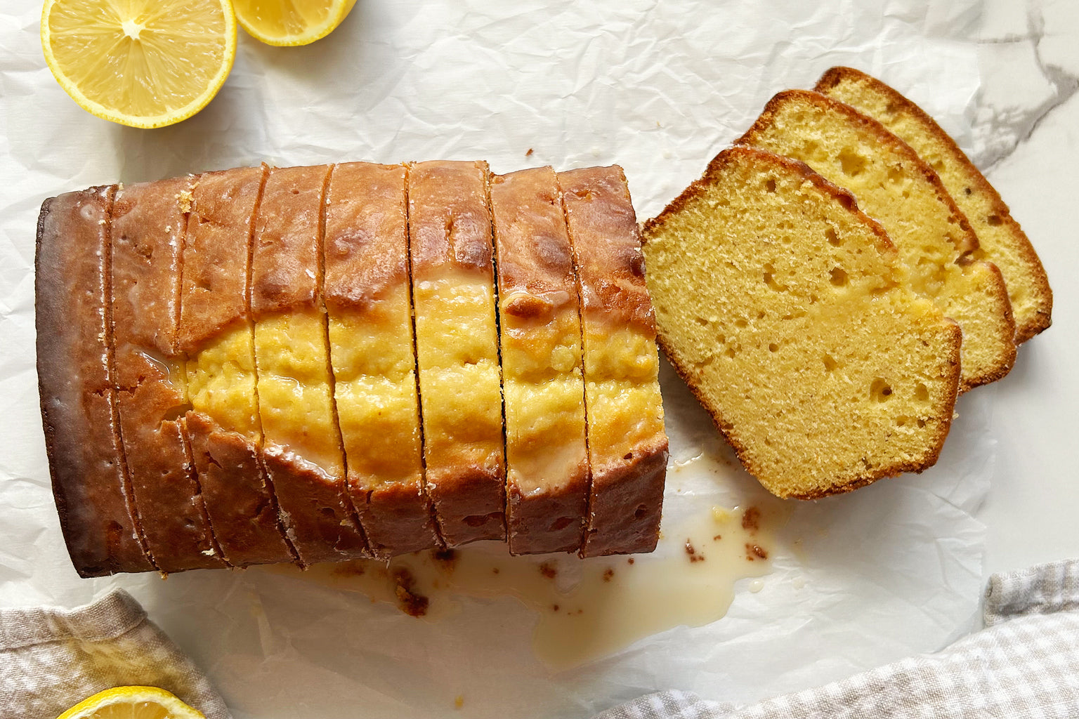 Sliced Einkorn Sourdough Lemon Yogurt Loaf Cake with lemon glaze
