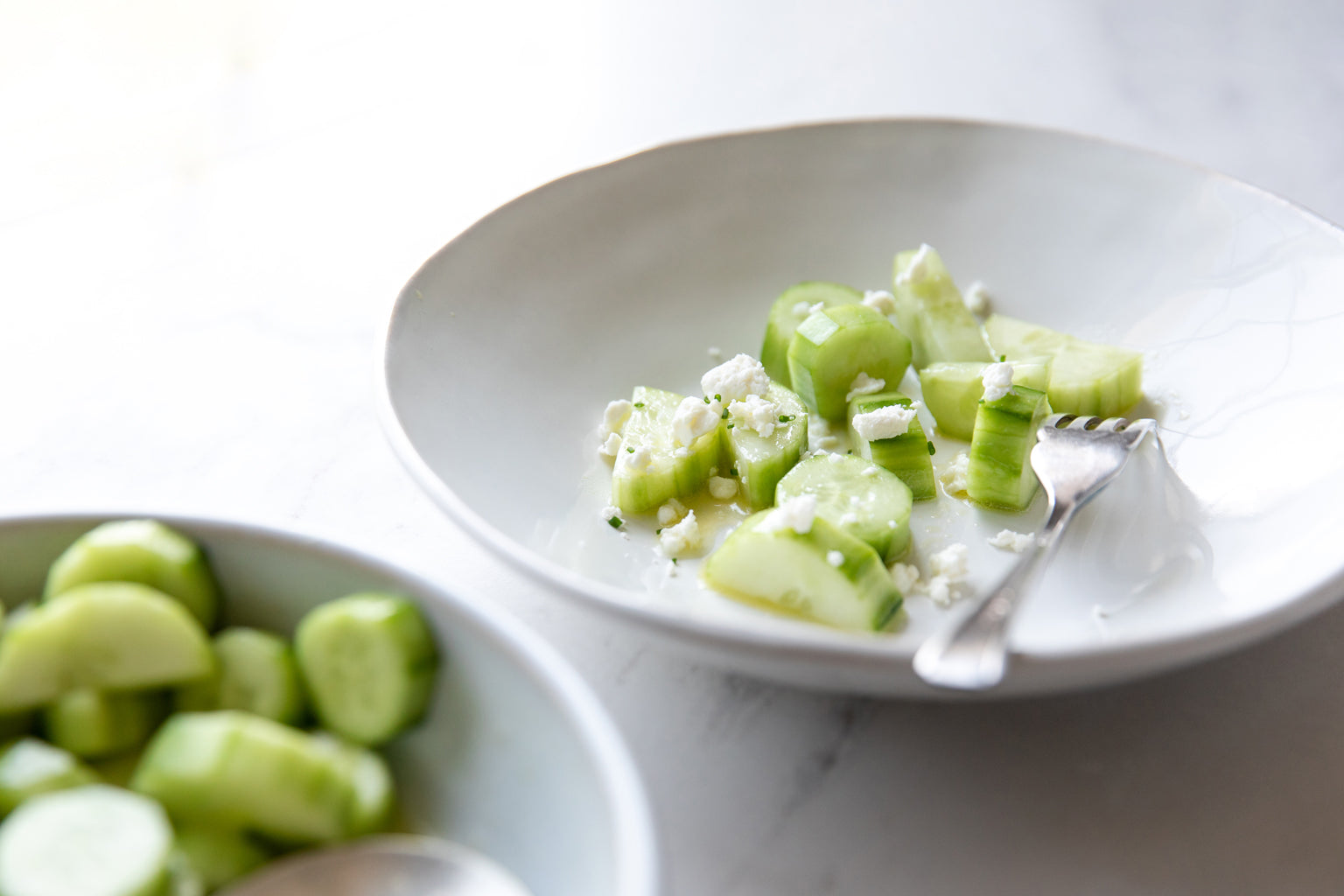 Slices of cucumber tossed in lemon juice and jovial Extra Virgin Olive Oil, topped with Goat CheeseCucumber Salad
