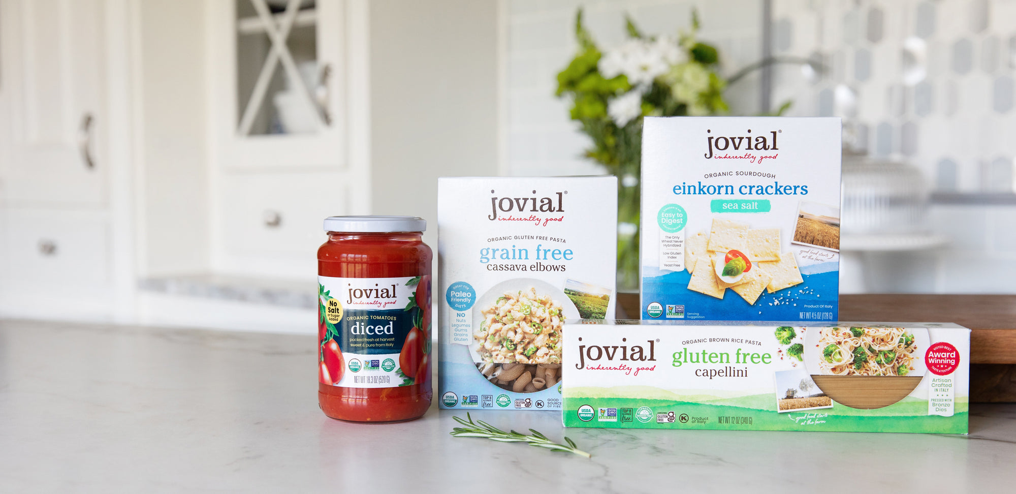 Jovial jar of diced tomatoes, grain-free cassava elbows, einkorn sea-salt crackers, and gluten-free capellini.