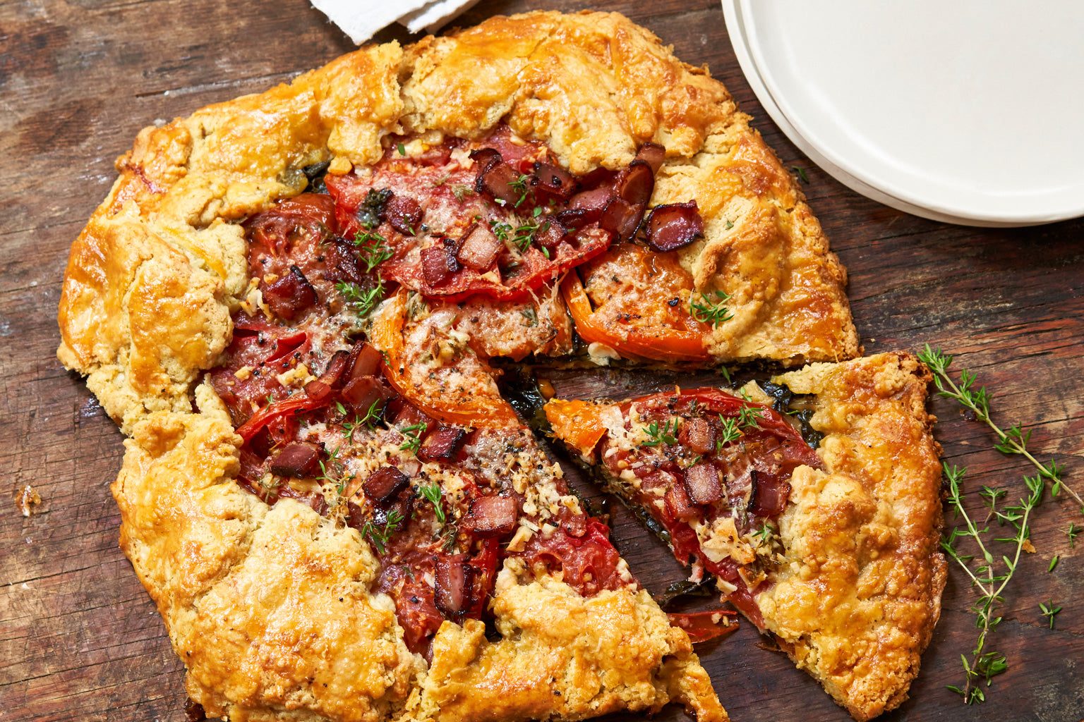 Baked einkorn galette with tomatoes and baconBaked einkorn galette with tomatoes and bacon