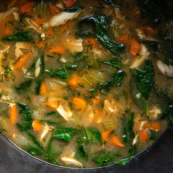 Closeup of a pot of Lemon Chicken orzo soup with Jovial Brown Rice Orzo